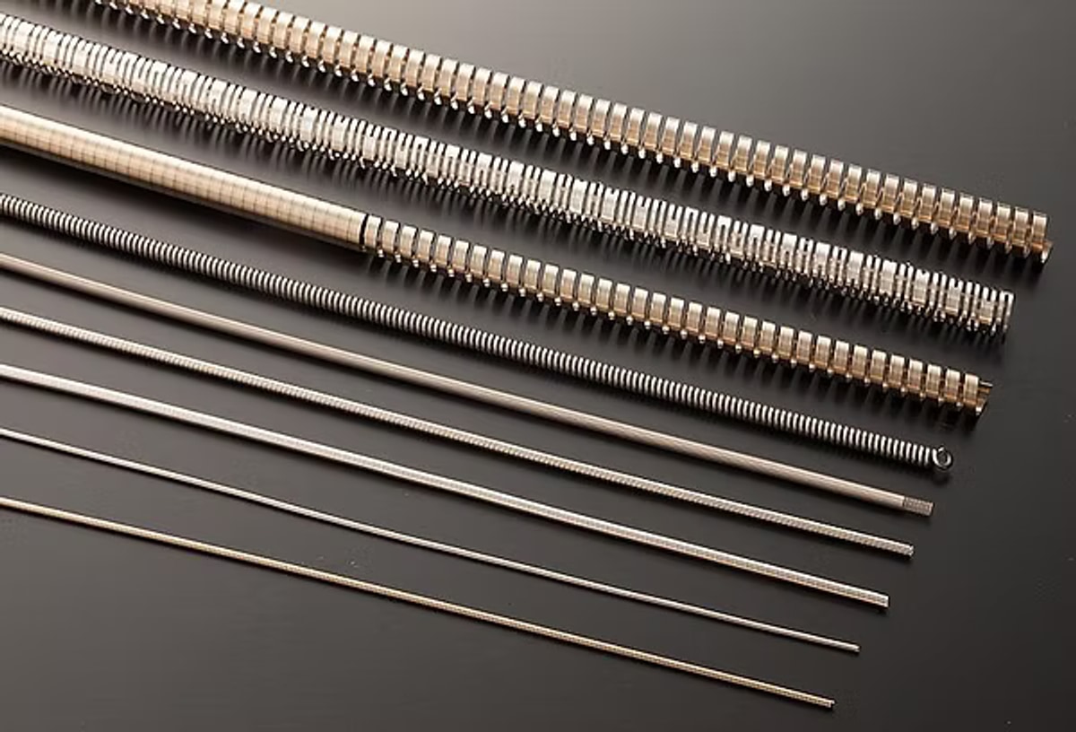 Long coil springs for endoscopes and medical instruments